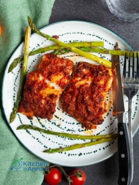 Baked cod in garlic and tomato