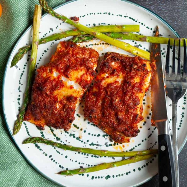 Baked cod in garlic and tomato