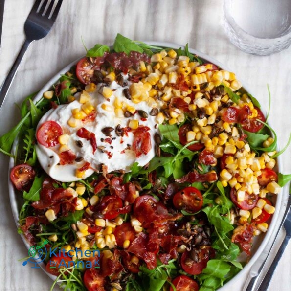 Burrata tomato corn salad with serrano ham