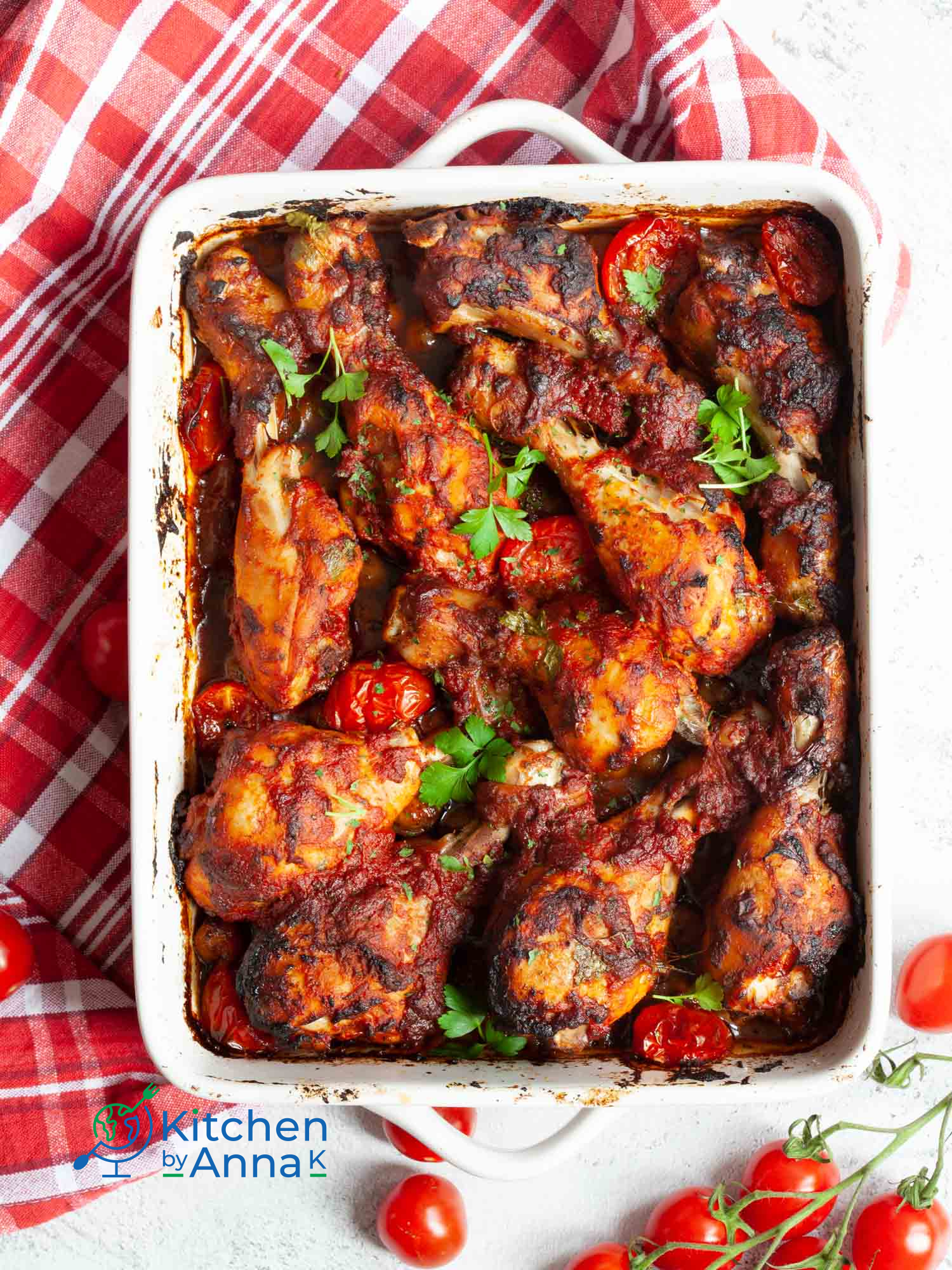 Sriracha and tomato baked chicken drumsticks with Mediterranean chickpeas