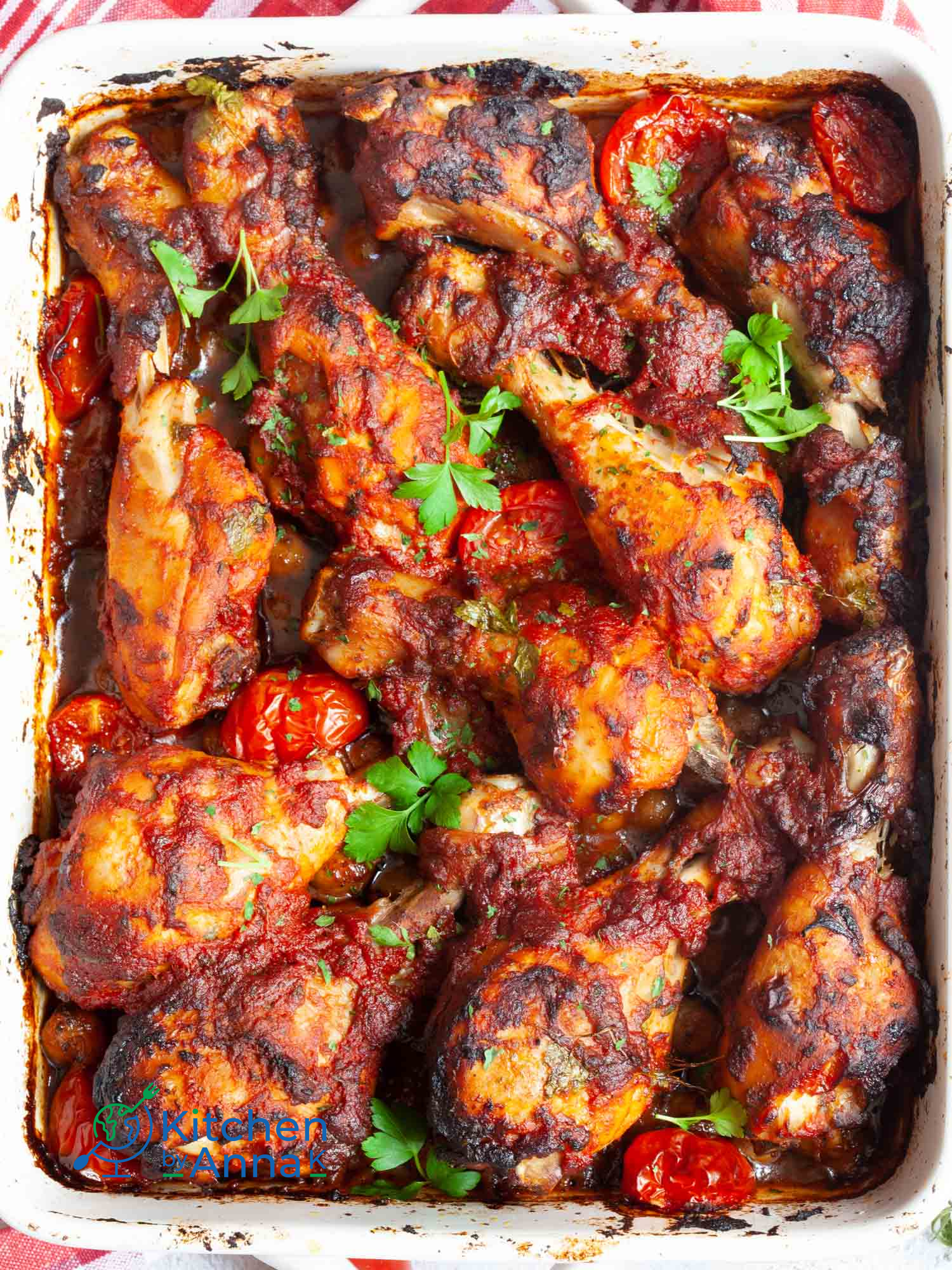 Sriracha and tomato baked chicken drumsticks with Mediterranean chickpeas