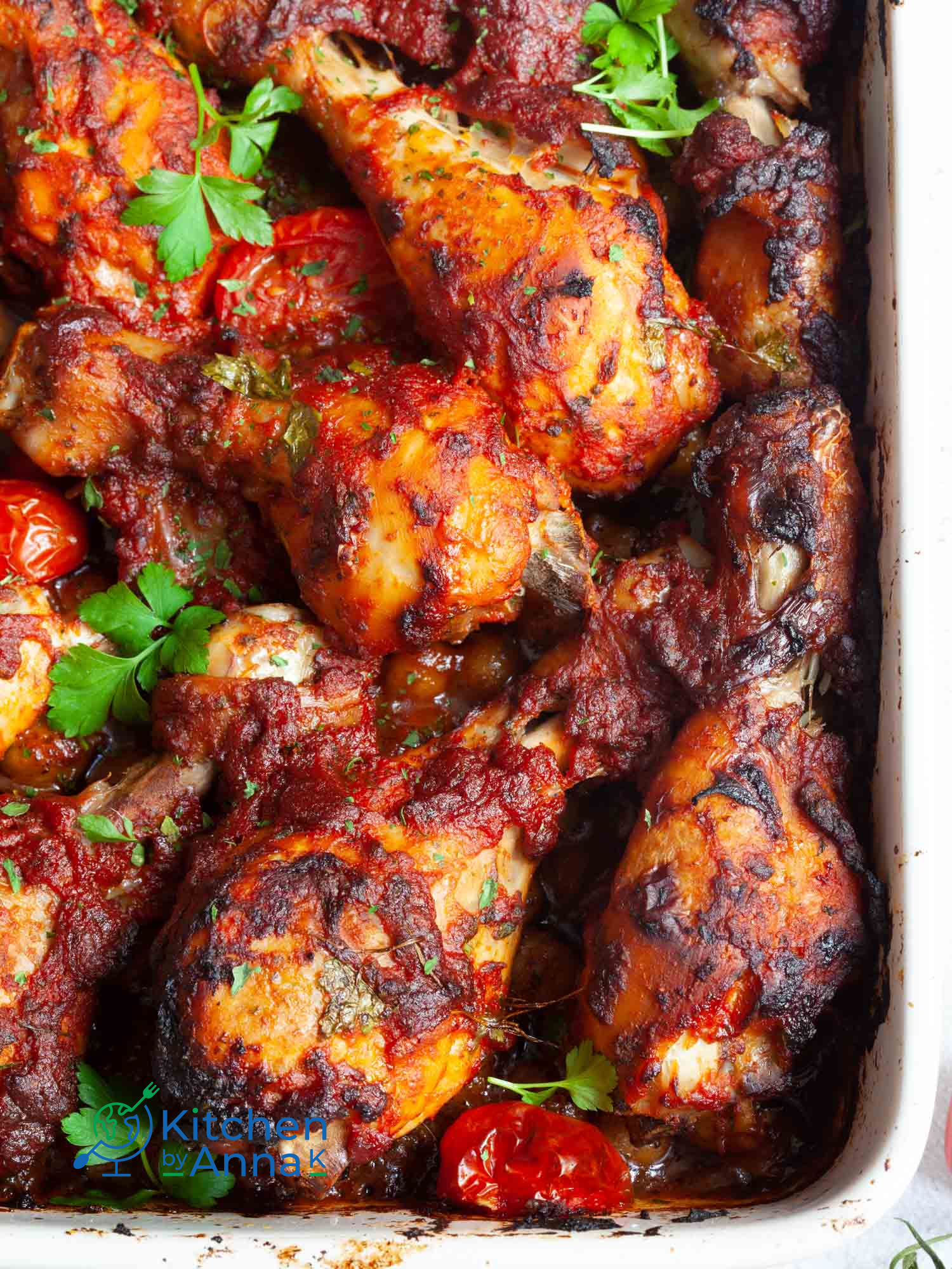 Sriracha and tomato baked chicken drumsticks with Mediterranean chickpeas