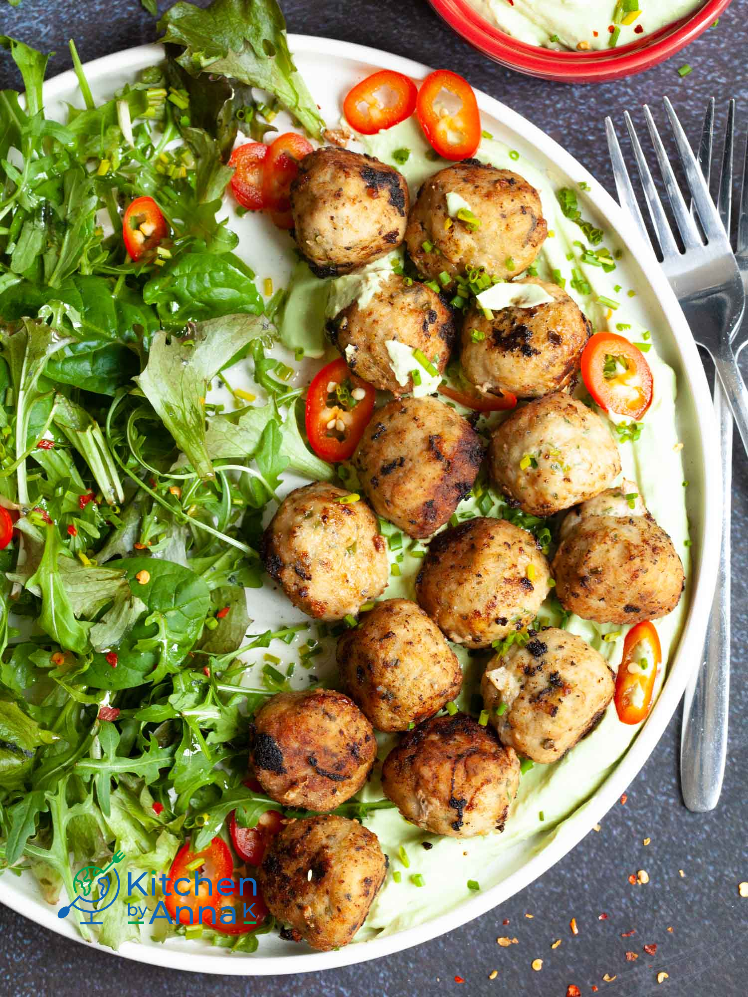 Pork meatballs with green onions and avocado yoghurt dip