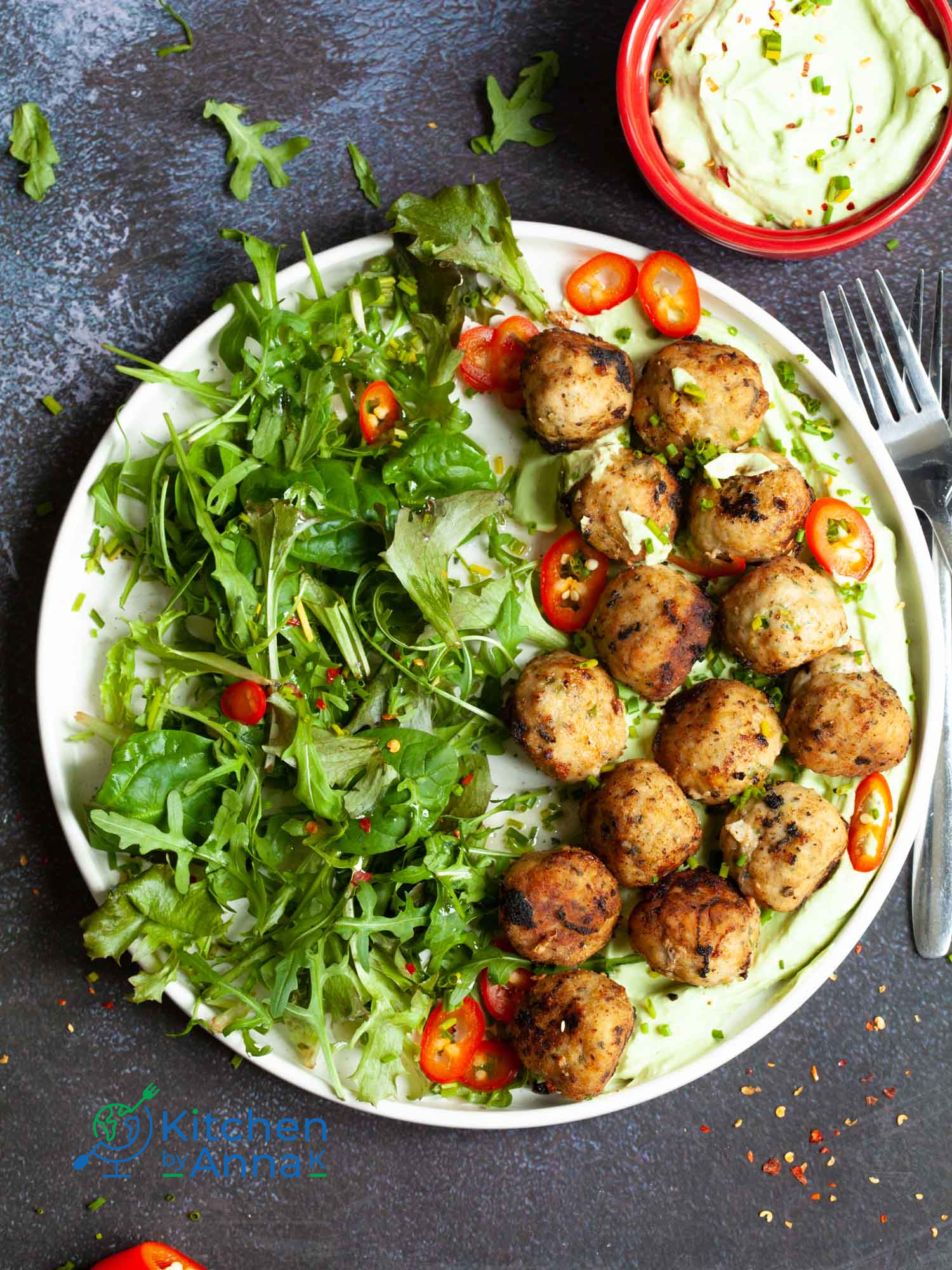 Pork meatballs with green onions and avocado yoghurt dip